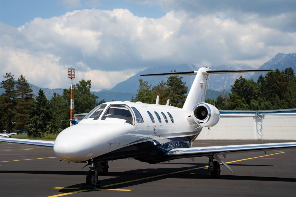 private jet aircraft type: light jet parked at airport