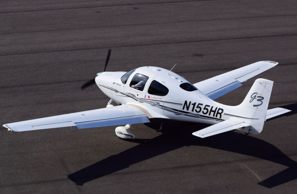 private jet planes types: small white private air taxi with one propeller engine